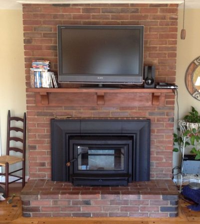 Clydesdale fireplace insert installed into a masonry fireplace After