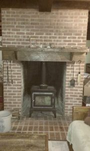 Hearthstone stove installed into a full masonry fireplace